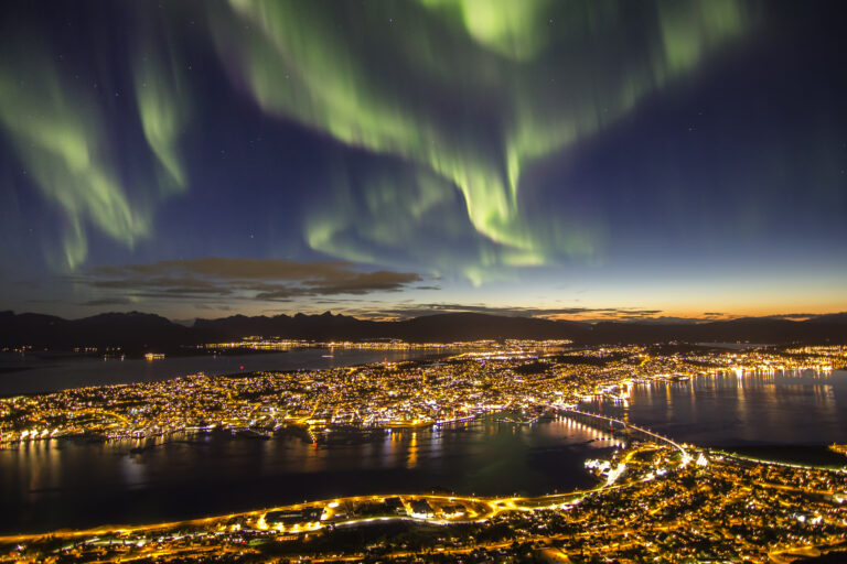 Aurora borealis over a cityscape